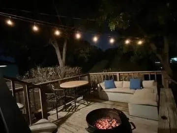 a balcony with furniture and a potted plant