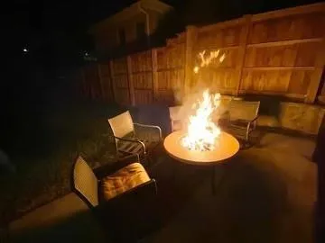 a view of a room with table and chairs