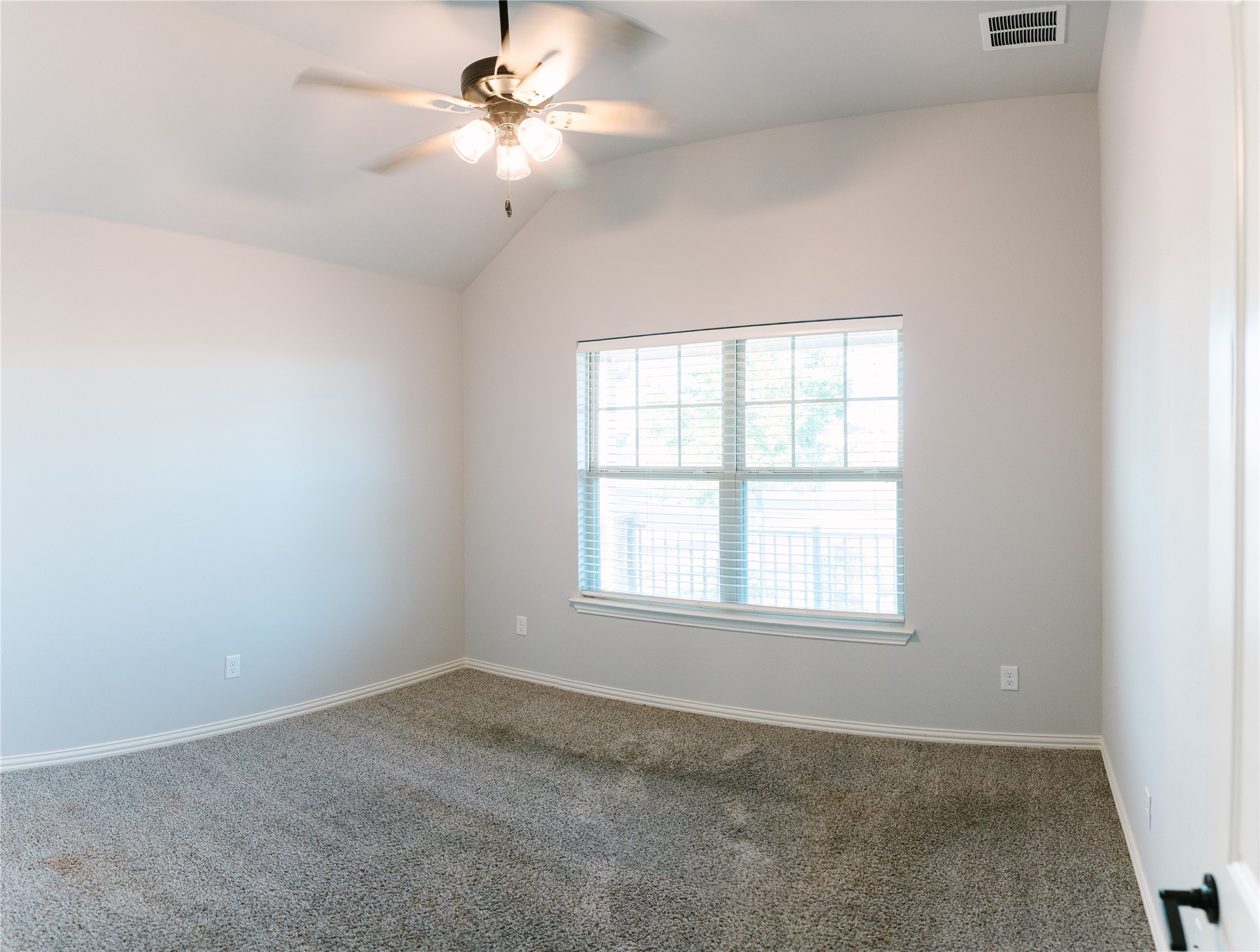 426 Cold Riv Run Kyle, TX 78640 - Photo 12 of 24 Carpeted spare room with ceiling fan and vaulted ceiling