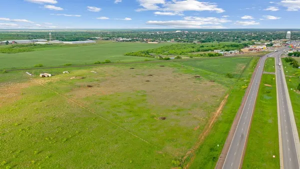 a view of a golf course with a lake
