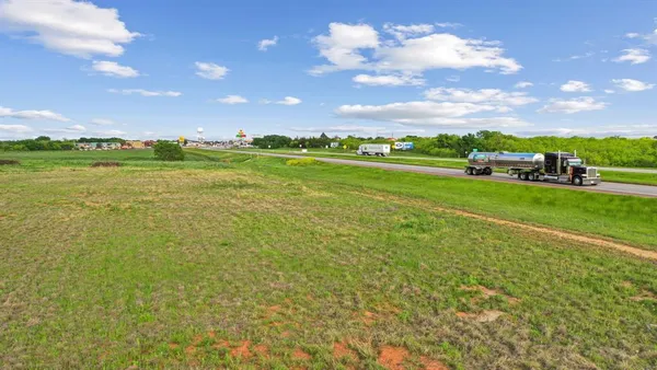 a view of a playground with basketball court