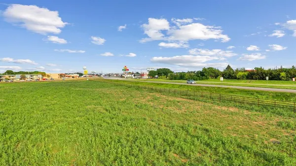 a view of a golf course with a big yard
