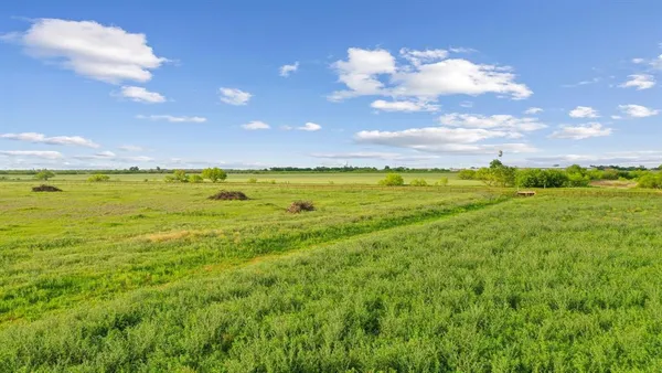 a view of an ocean and a yard