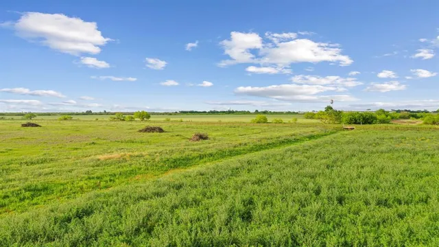 a view of an ocean and a yard