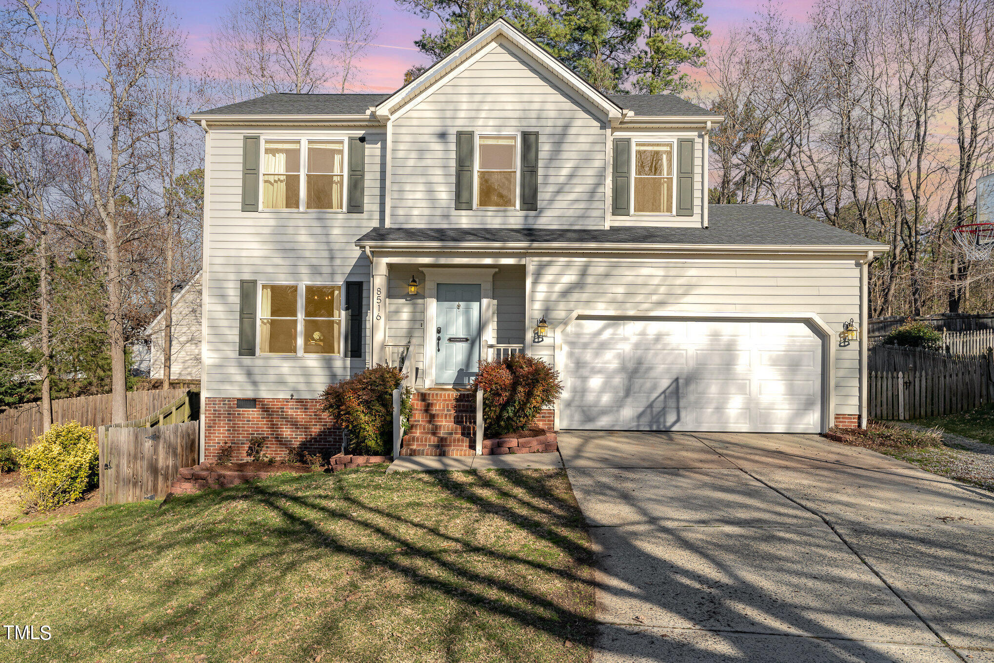 8516 Metronome Lane Raleigh, NC 27613 - Photo 1 of 25 a front view of a house with a yard