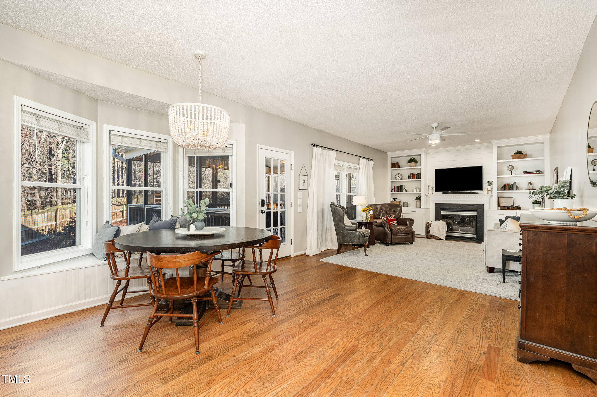 8516 Metronome Lane Raleigh, NC 27613 - Photo 11 of 25 a view of a dining room with furniture and wooden floor