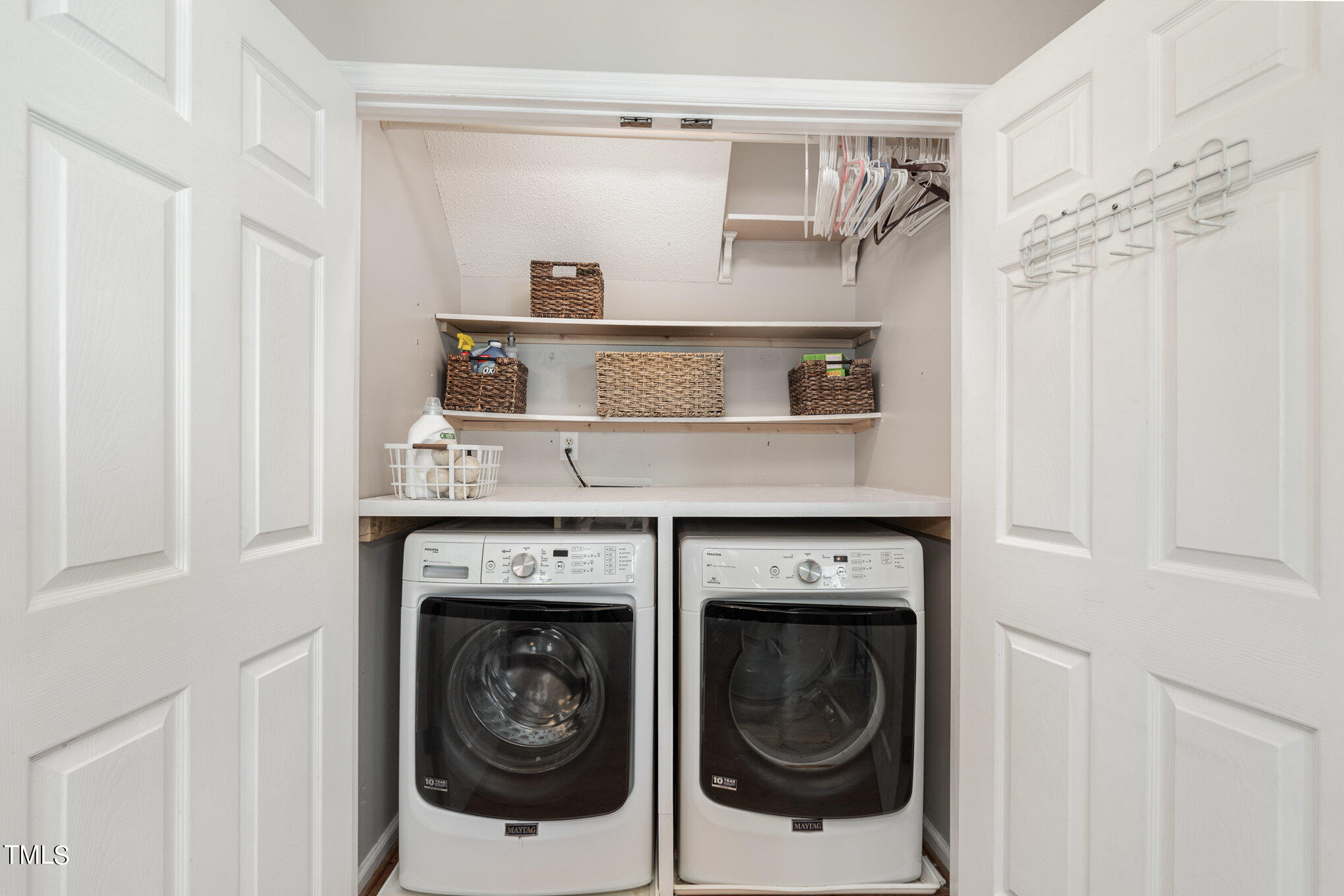 8516 Metronome Lane Raleigh, NC 27613 - Photo 13 of 25 a close view of a utility room with dryer and washer