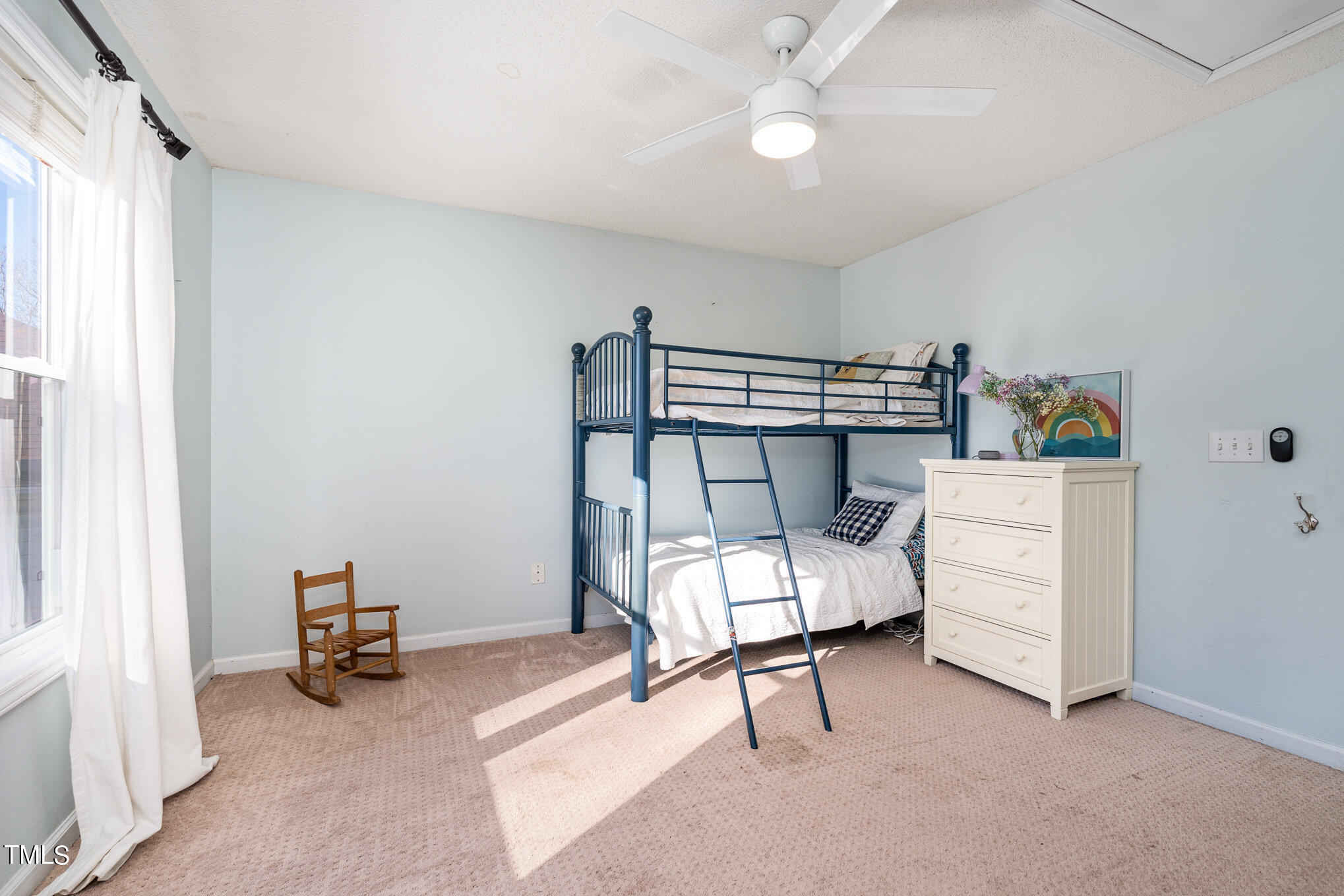 8516 Metronome Lane Raleigh, NC 27613 - Photo 20 of 25 a bedroom with furniture and a window