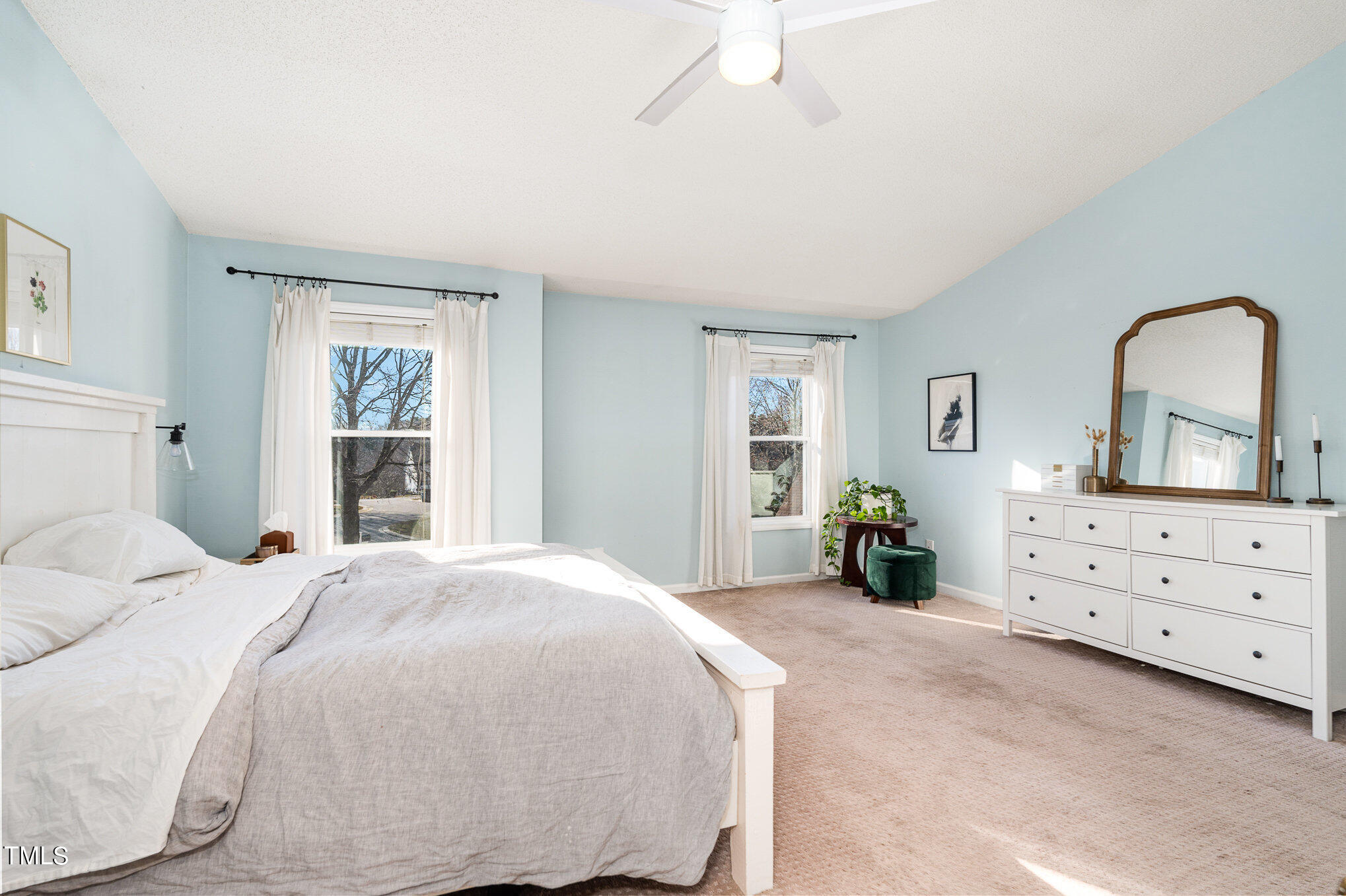 8516 Metronome Lane Raleigh, NC 27613 - Photo 3 of 25 a bedroom with a bed and a dresser in it