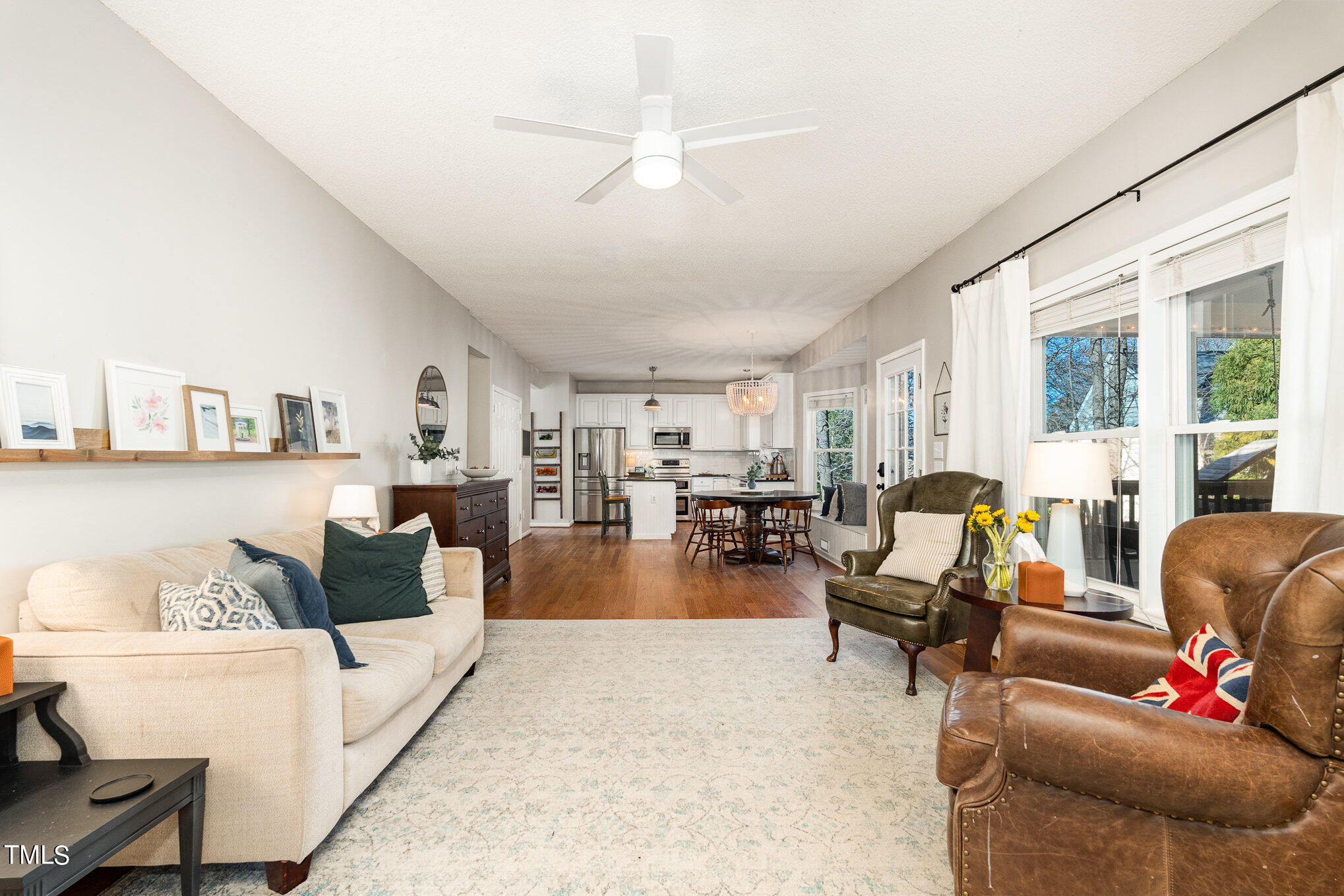 8516 Metronome Lane Raleigh, NC 27613 - Photo 8 of 25 a living room with furniture and a large window