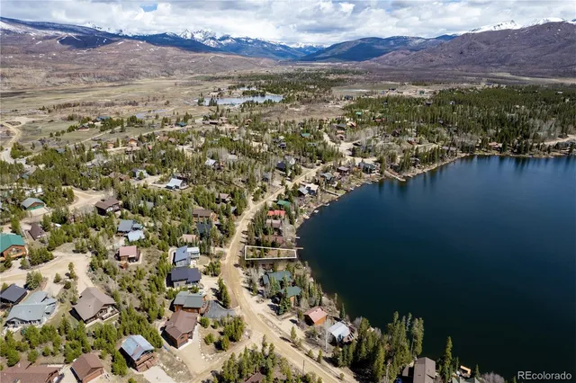 a view of a city with mountains in the background