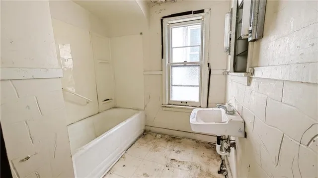 a bathroom with a sink toilet and bathtub