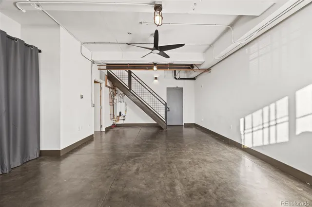 a view of an empty room with stairs