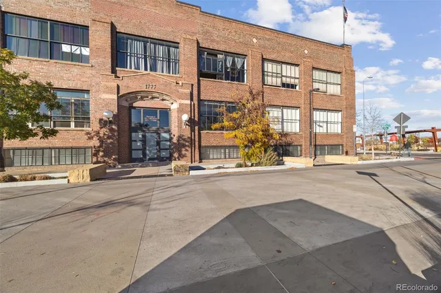 a view of a swimming pool with outdoor seating