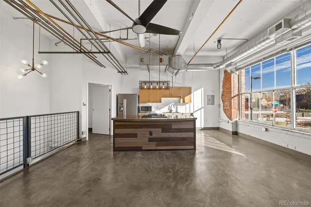 a view of hall way with furniture