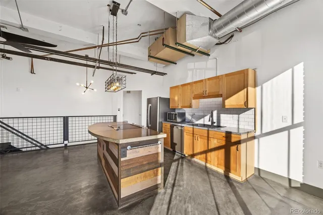 a bathroom with a tub a sink and a window