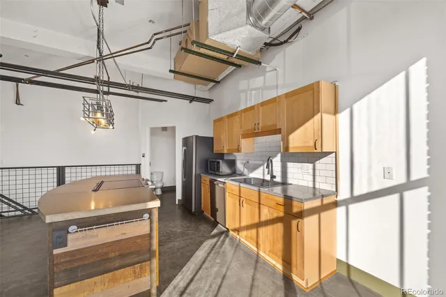 a kitchen that has a lot of cabinets in it