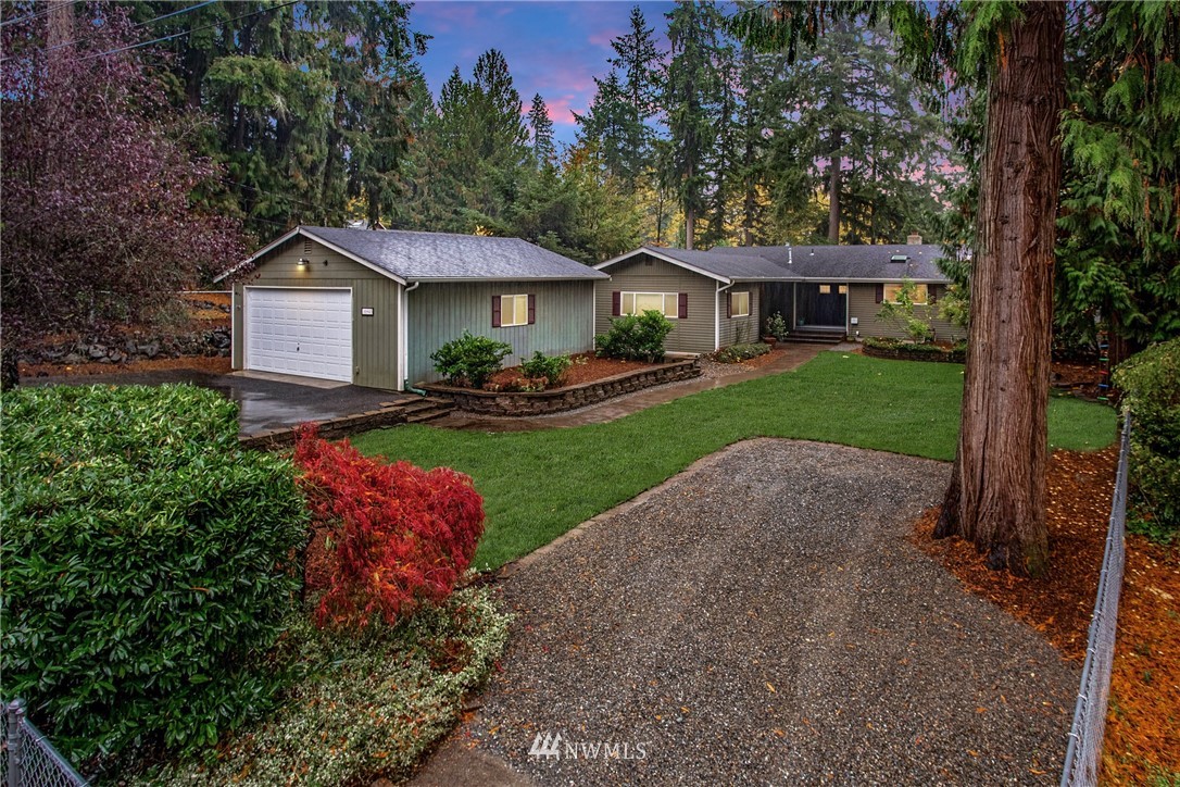 16945 Southeast 149th Street Renton, WA 98059 - Photo 1 of 40 a front view of a house with a yard and garage