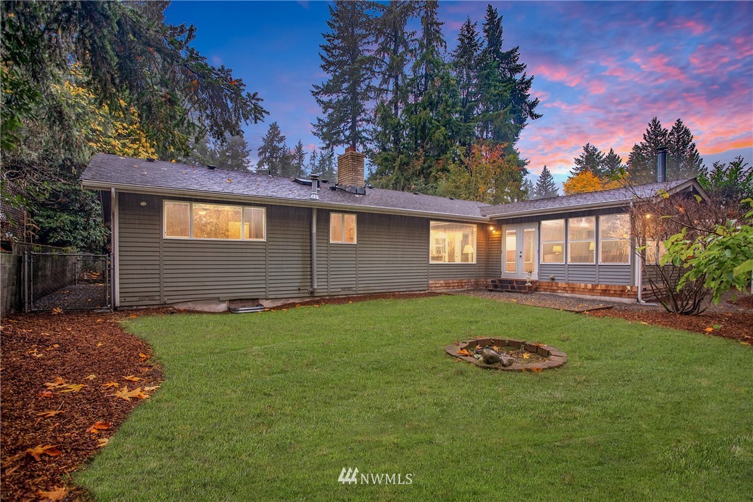 16945 Southeast 149th Street Renton, WA 98059 - Photo 19 of 40 a backyard of a house with yard table and chairs