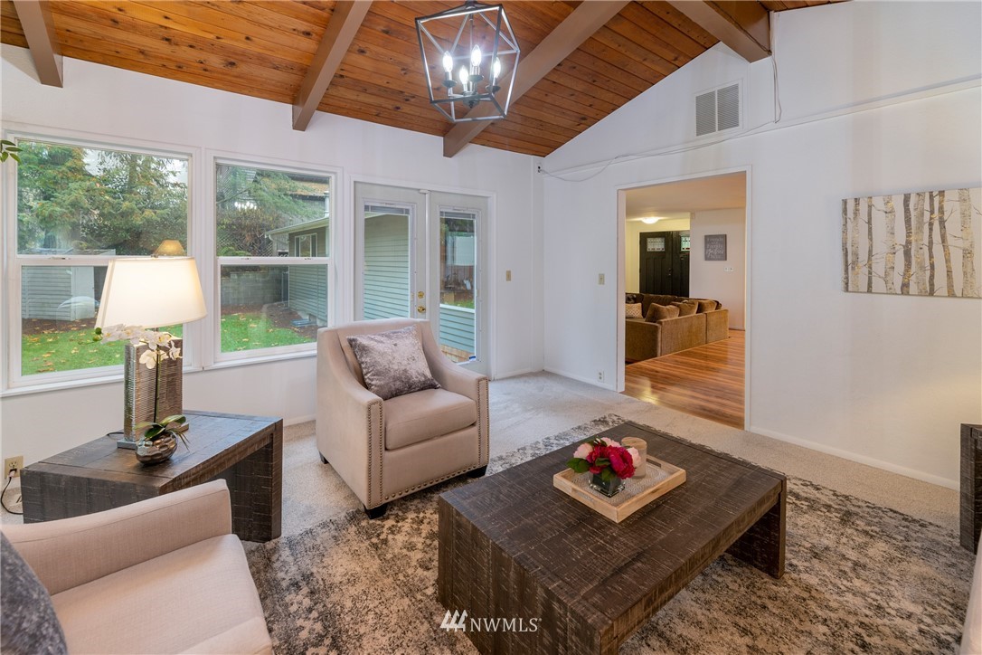 16945 Southeast 149th Street Renton, WA 98059 - Photo 20 of 40 a living room with furniture and a large window