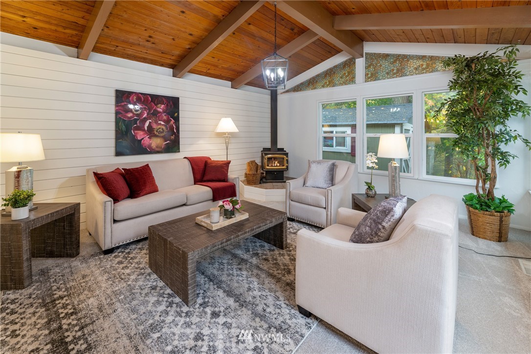 16945 Southeast 149th Street Renton, WA 98059 - Photo 21 of 40 a living room with furniture and a large window