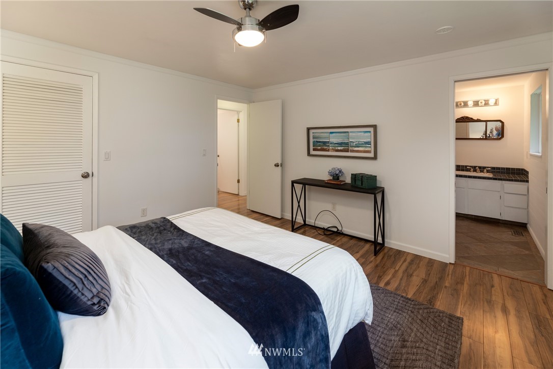 16945 Southeast 149th Street Renton, WA 98059 - Photo 23 of 40 a bedroom with a bed and wooden floor