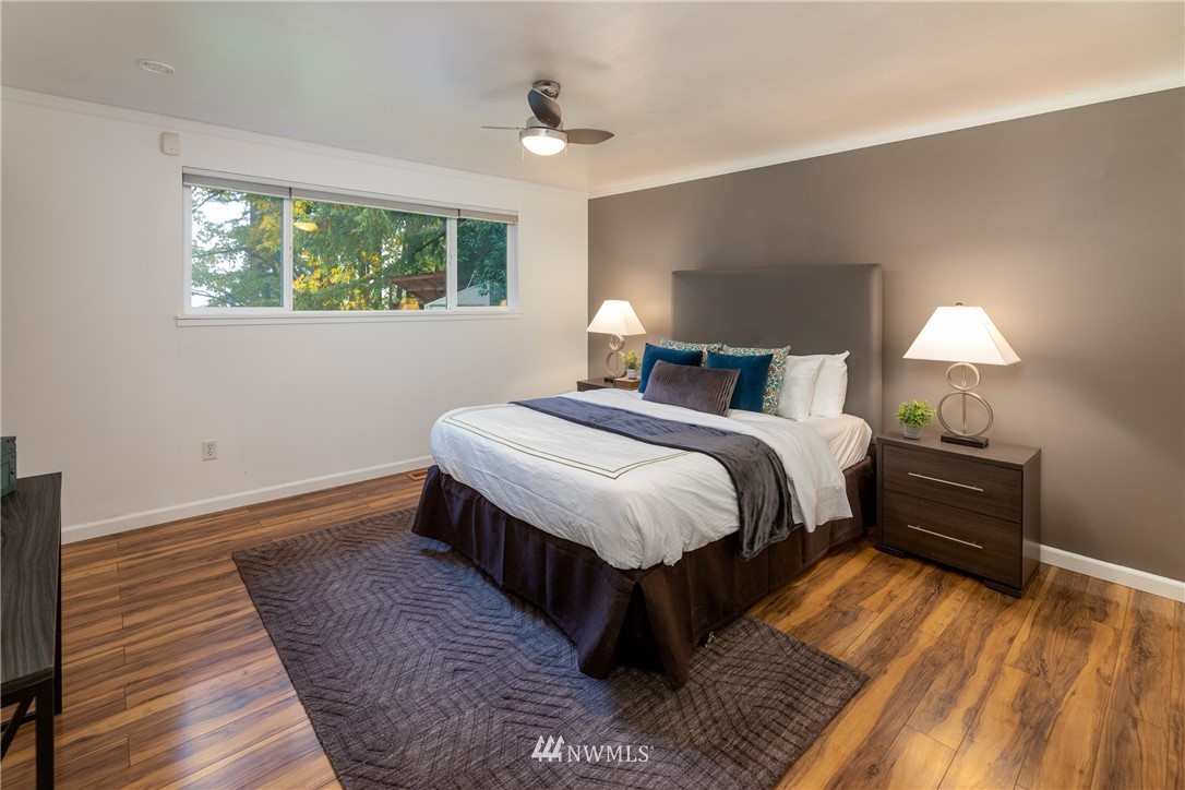 16945 Southeast 149th Street Renton, WA 98059 - Photo 24 of 40 a bed room with a bed and a lamp