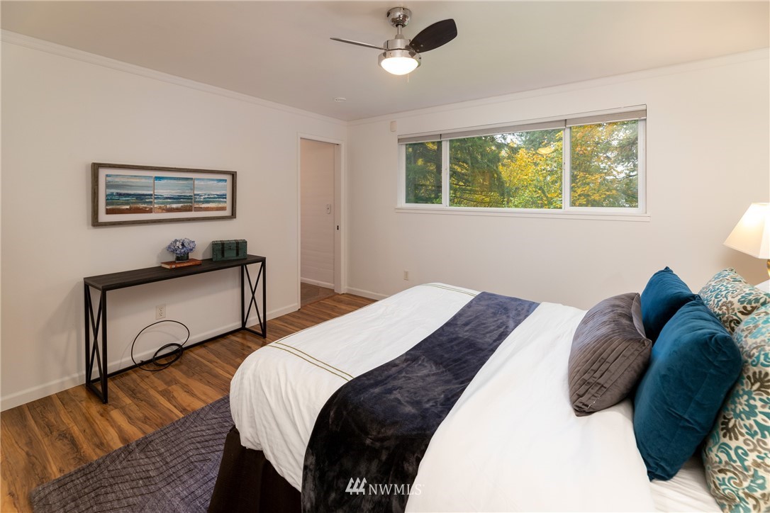 16945 Southeast 149th Street Renton, WA 98059 - Photo 25 of 40 a bedroom with a bed and a window