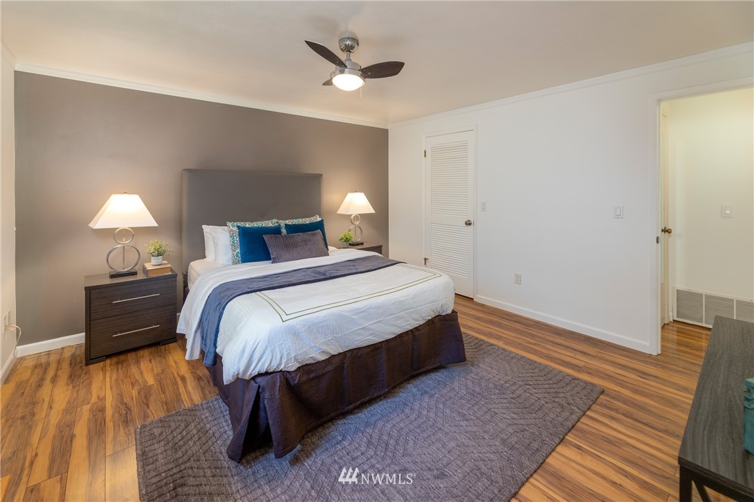 16945 Southeast 149th Street Renton, WA 98059 - Photo 27 of 40 a bedroom with a bed and wooden floor