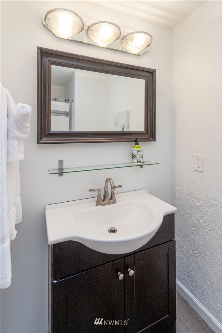 16945 Southeast 149th Street Renton, WA 98059 - Photo 30 of 40 a bathroom with a sink vanity and a mirror