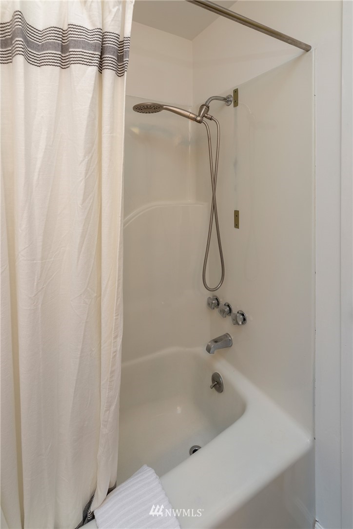 16945 Southeast 149th Street Renton, WA 98059 - Photo 31 of 40 a bathroom with a bath tub and a shower