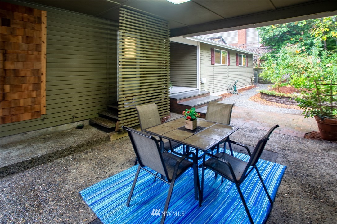 16945 Southeast 149th Street Renton, WA 98059 - Photo 33 of 40 a view of a backyard with table and chairs and potted plants