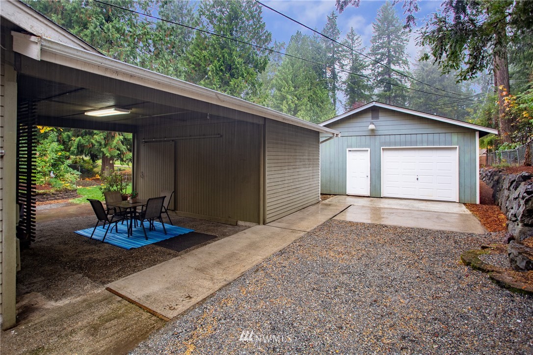 16945 Southeast 149th Street Renton, WA 98059 - Photo 34 of 40 a backyard of a house with a large tree and wooden fence