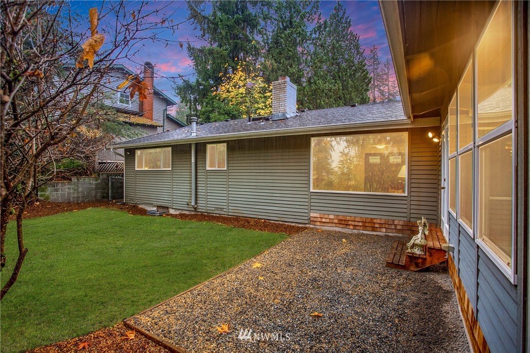 16945 Southeast 149th Street Renton, WA 98059 - Photo 36 of 40 a view of a backyard with table and chairs and potted plants