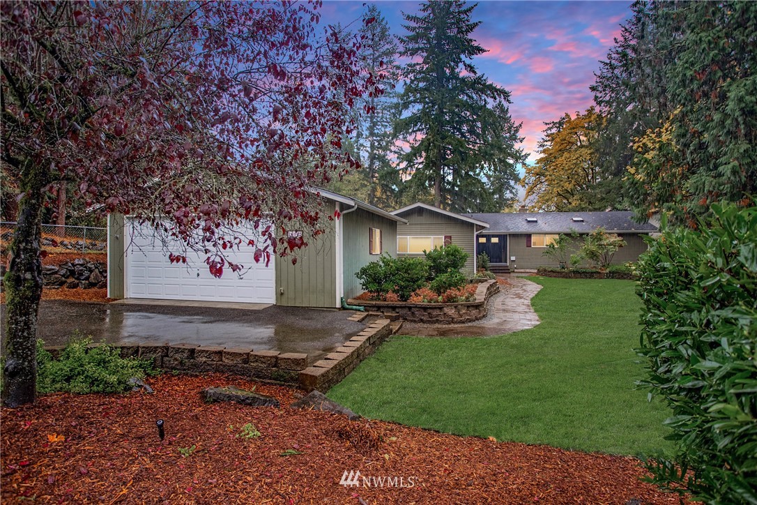 16945 Southeast 149th Street Renton, WA 98059 - Photo 40 of 40 a front view of a house with a garden