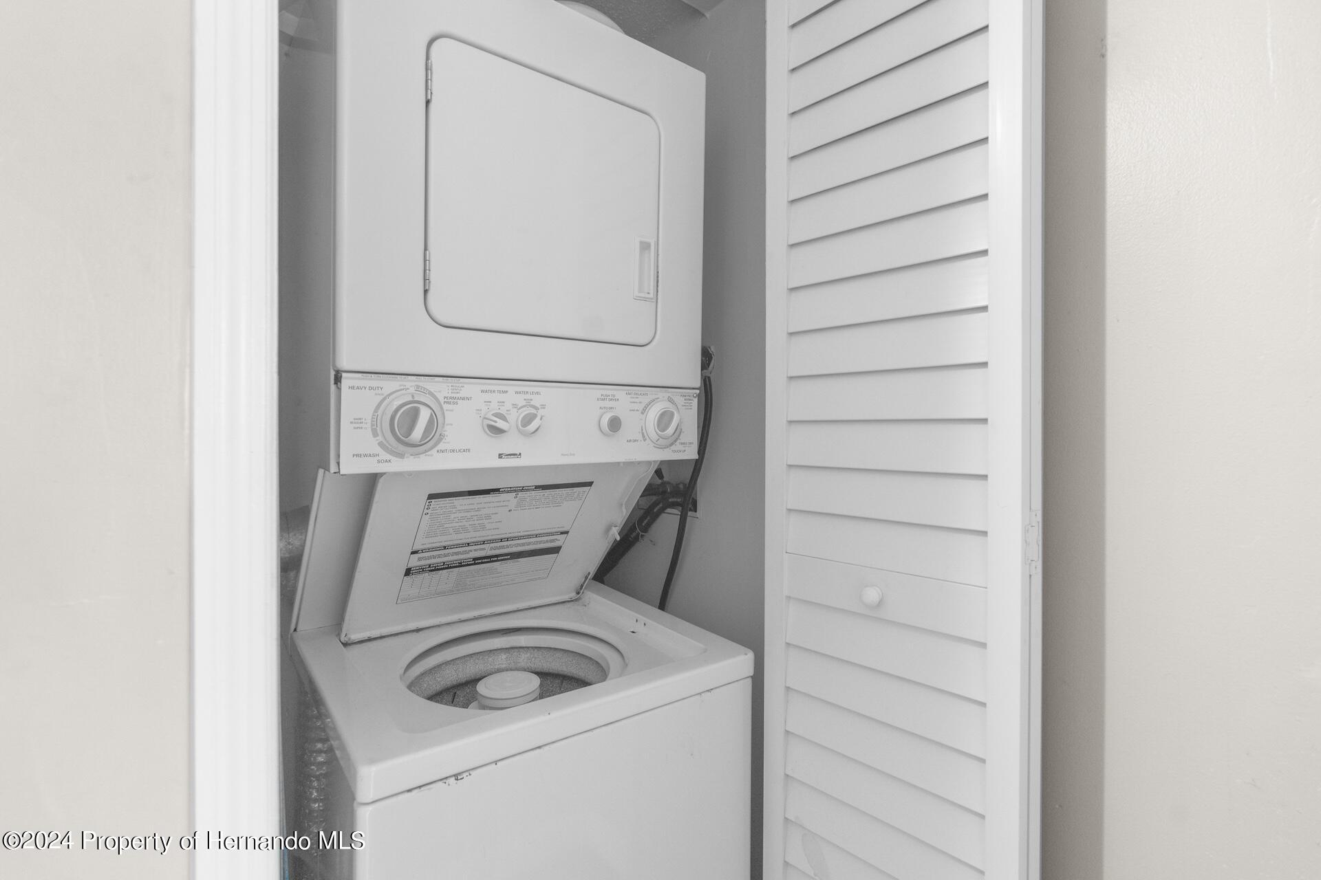 5541 Bay Boulevard Port Richey, FL 34668 - Photo 13 of 22 a close up view of a washer and dryer
