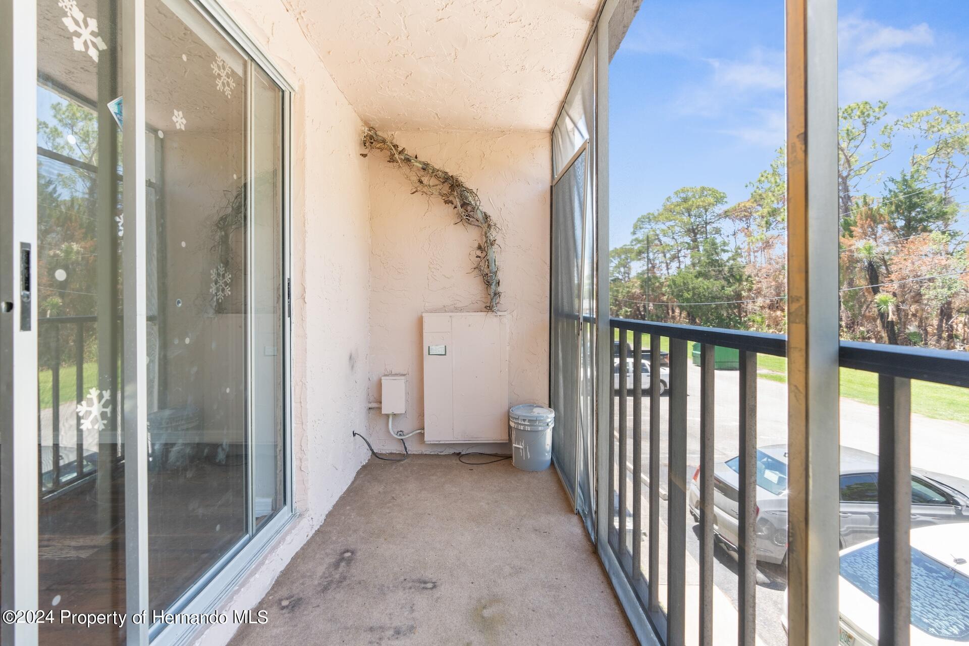 5541 Bay Boulevard Port Richey, FL 34668 - Photo 16 of 22 a view of a bathroom with a glass door