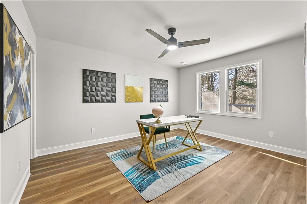 3413 Underwood Road Southeast Conyers, GA 30013 - Photo 16 of 42 a work room with wooden floor and a window