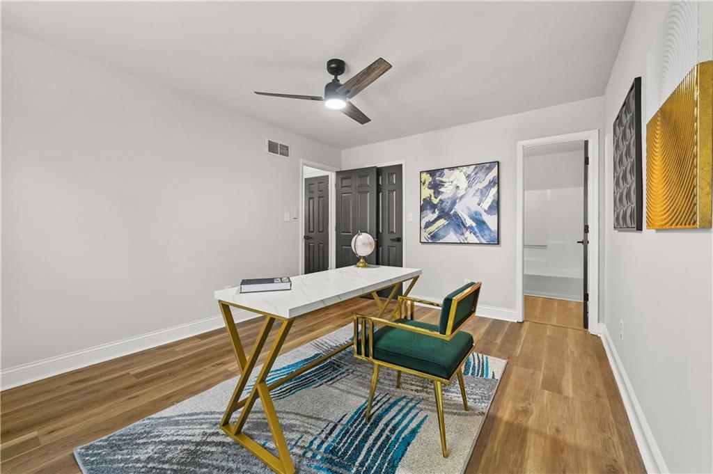 3413 Underwood Road Southeast Conyers, GA 30013 - Photo 18 of 42 a work room with furniture and a wooden floor