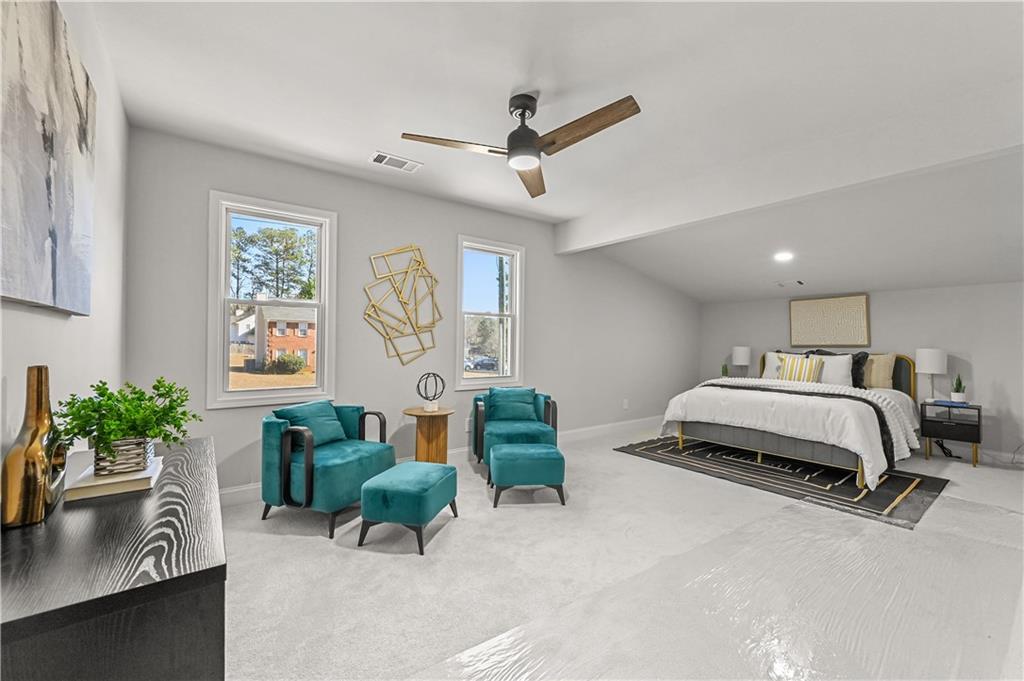 3413 Underwood Road Southeast Conyers, GA 30013 - Photo 23 of 42 a bedroom with a bed a couch and potted plant