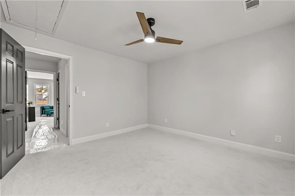 3413 Underwood Road Southeast Conyers, GA 30013 - Photo 26 of 42 en empty room with windows