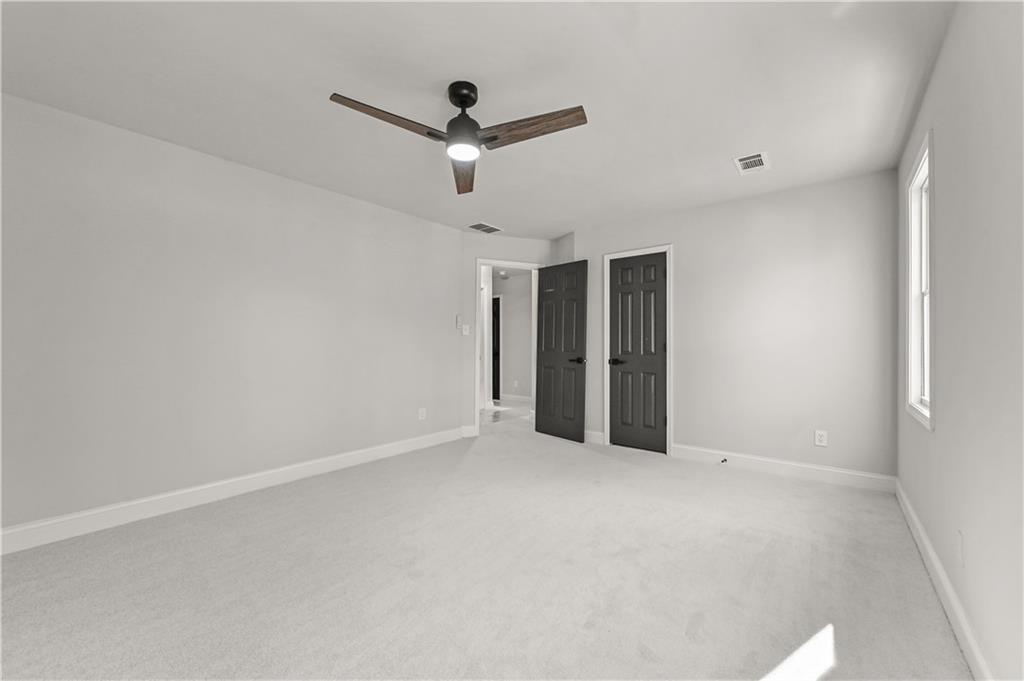 3413 Underwood Road Southeast Conyers, GA 30013 - Photo 27 of 42 a view of an empty room with a ceiling fan