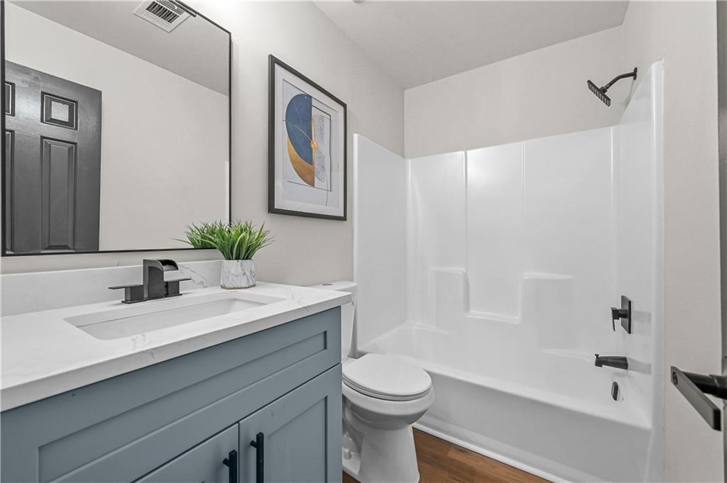 3413 Underwood Road Southeast Conyers, GA 30013 - Photo 28 of 42 a bathroom with a sink a toilet and shower