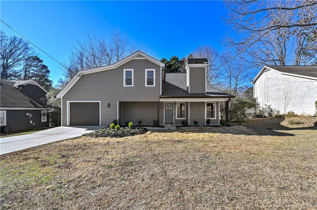 3413 Underwood Road Southeast Conyers, GA 30013 - Photo 3 of 42 a front view of a house with a yard