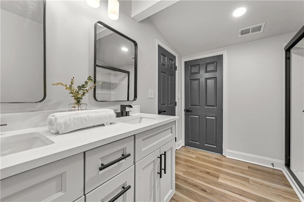 3413 Underwood Road Southeast Conyers, GA 30013 - Photo 32 of 42 a bathroom with 2 sink and a mirror