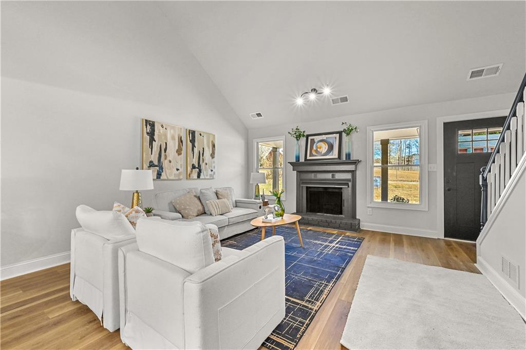 3413 Underwood Road Southeast Conyers, GA 30013 - Photo 7 of 42 a living room with furniture and a fireplace