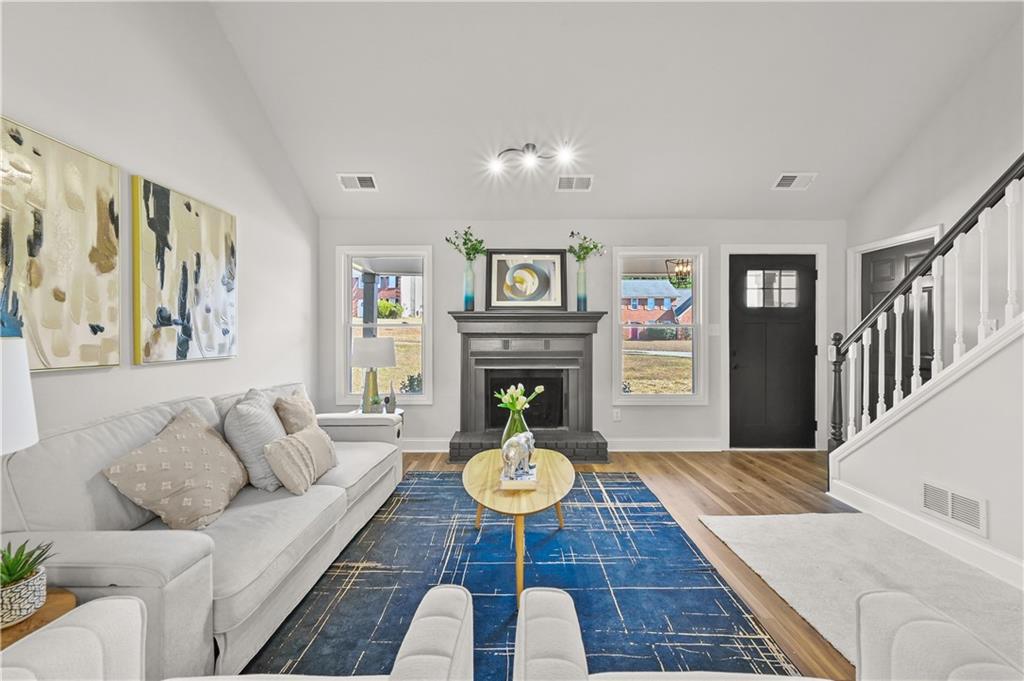 3413 Underwood Road Southeast Conyers, GA 30013 - Photo 8 of 42 a living room with furniture and a fireplace