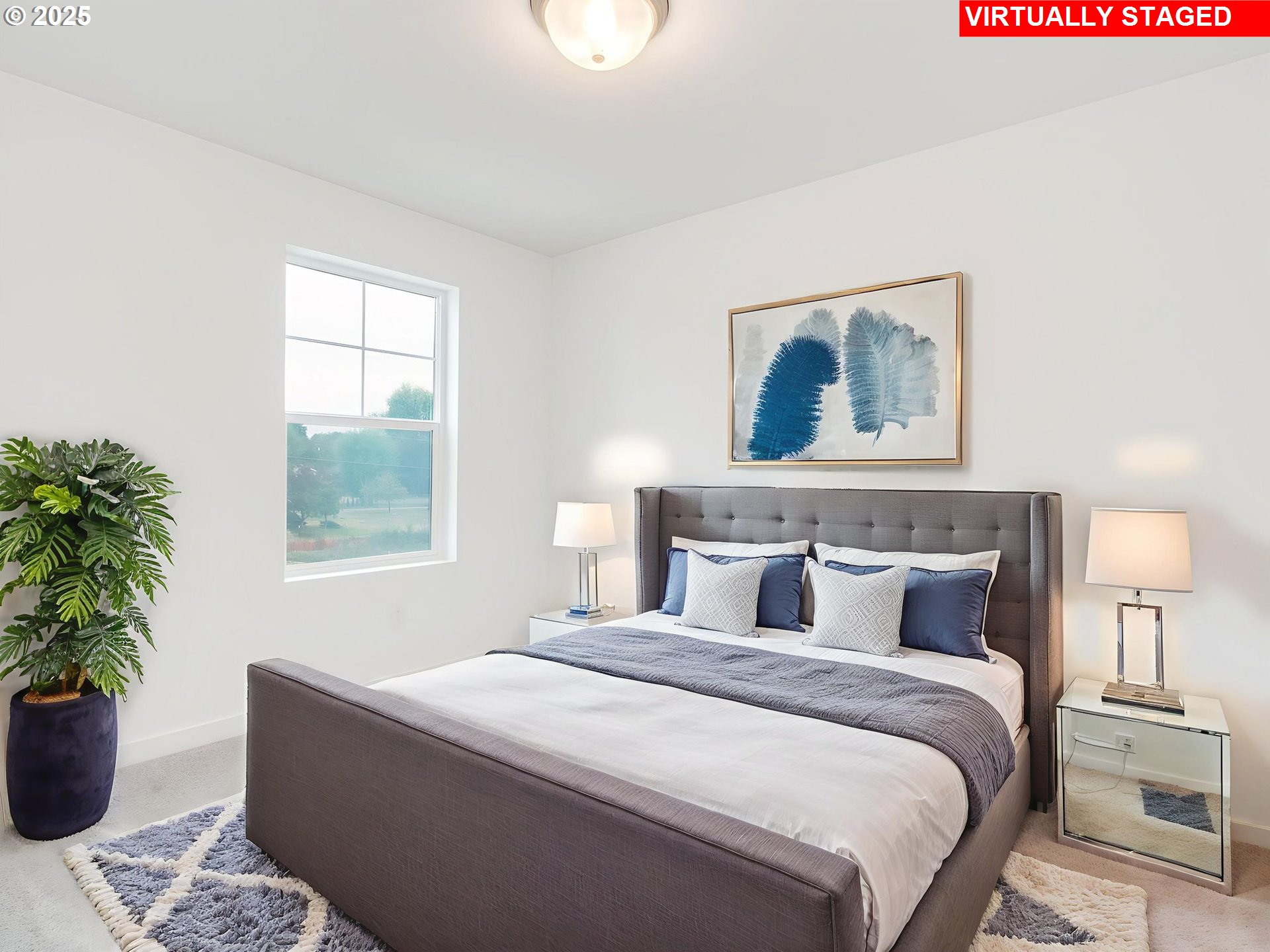 2125 Southwest 5th Place Battle Ground, WA 98604 - Photo 26 of 36 a bedroom with a large bed and a potted plant