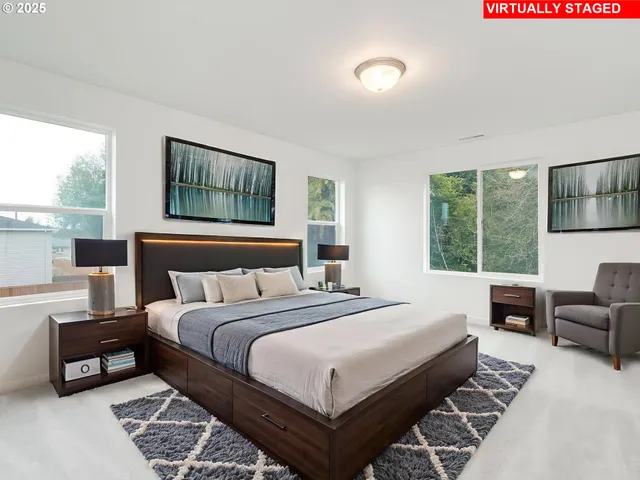 a bedroom with a bed and glass window