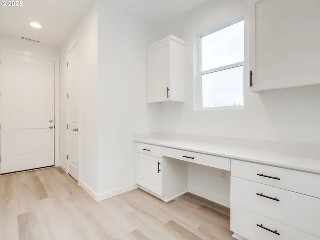 a view of cabinets and window